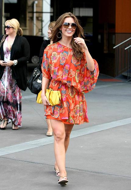 Audrina Patridge showed off her sexy stems in this retro pleated print during a recent trip to Australia.